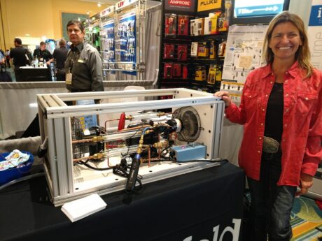 Theresa at HVACR Event in Orlando with the TU-805 HVAC Lab Trainer